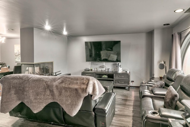 living room featuring dark wood finished floors, recessed lighting, and baseboards