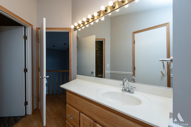 bathroom featuring wood finished floors and vanity