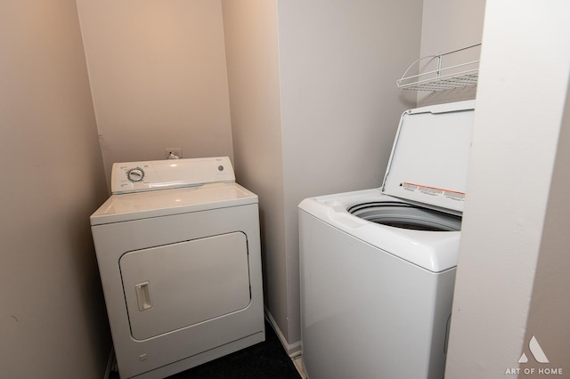 clothes washing area featuring laundry area and washer and dryer