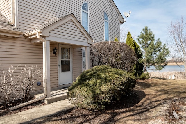 property entrance featuring a water view