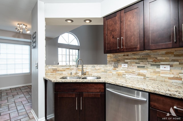 kitchen featuring a sink, dark brown cabinetry, decorative backsplash, baseboards, and dishwasher