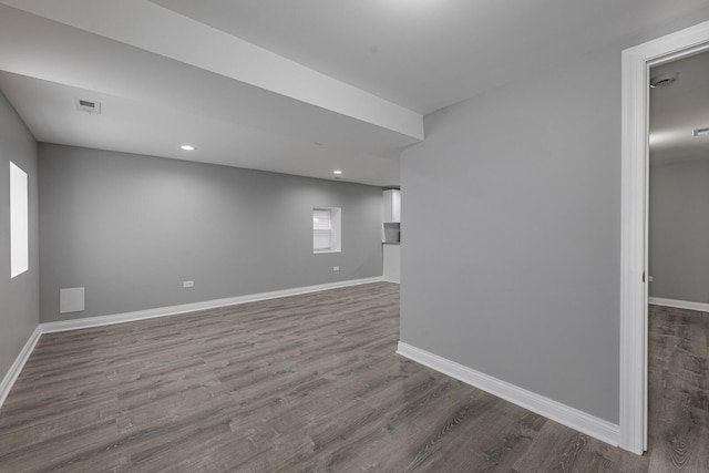 interior space with recessed lighting, visible vents, baseboards, and dark wood-style floors