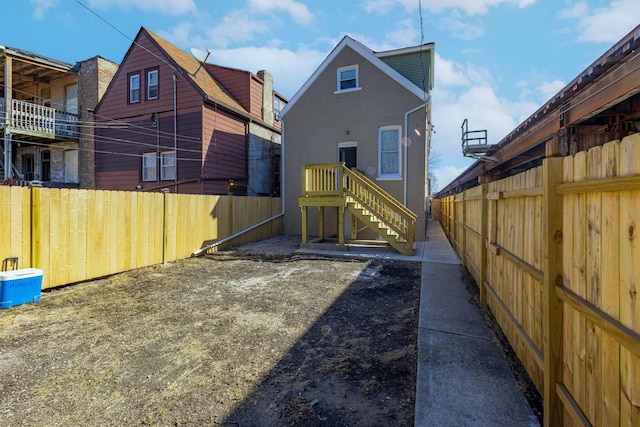 back of property featuring fence