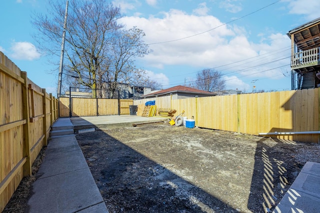 view of yard with a patio and a fenced backyard