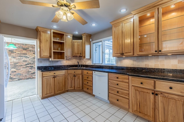 kitchen with white appliances, light tile patterned floors, open shelves, a sink, and tasteful backsplash