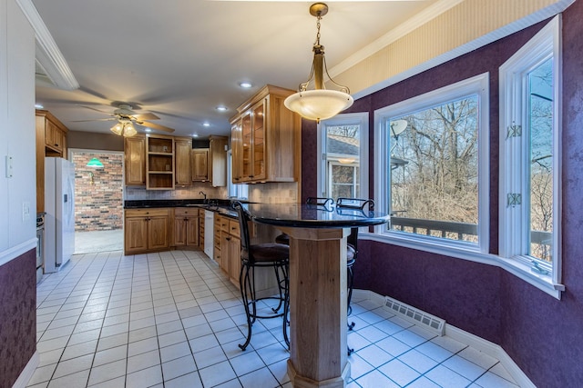 kitchen with visible vents, open shelves, dark countertops, white appliances, and light tile patterned flooring