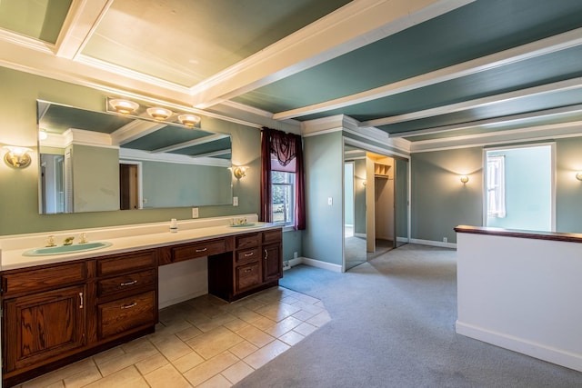 full bath featuring beam ceiling, a sink, carpet floors, double vanity, and baseboards