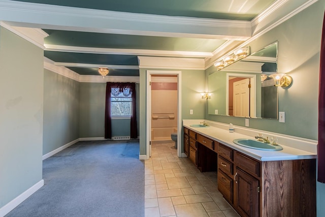 bathroom with toilet, baseboards, and a sink