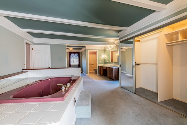 full bathroom with vanity, crown molding, beamed ceiling, and a jetted tub