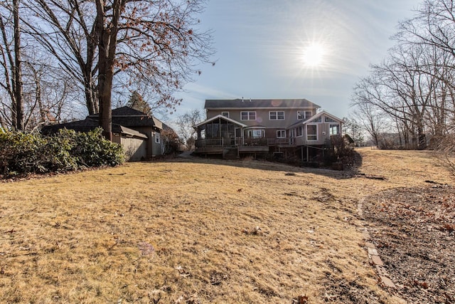 rear view of property with a deck