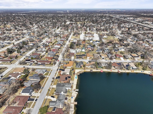 bird's eye view with a residential view and a water view