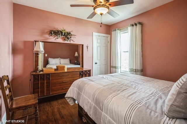 bedroom featuring dark wood-type flooring and ceiling fan