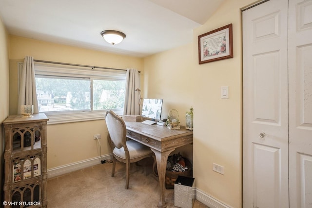 carpeted office with baseboards