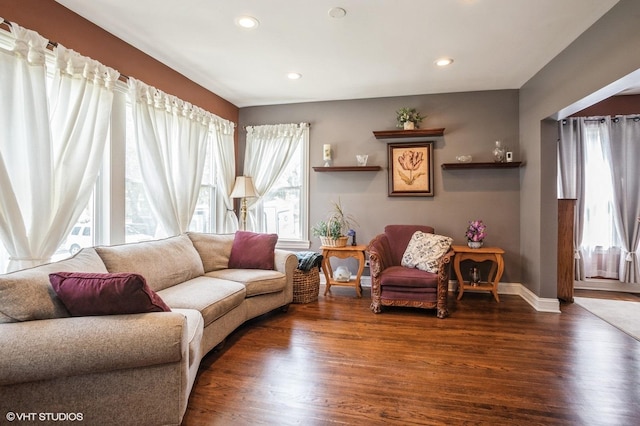 living room featuring recessed lighting, wood finished floors, and baseboards