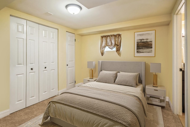 bedroom featuring baseboards, a closet, and carpet floors