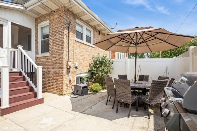 view of patio / terrace with outdoor dining space and fence