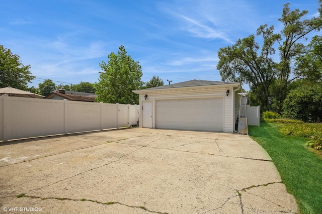 detached garage with fence