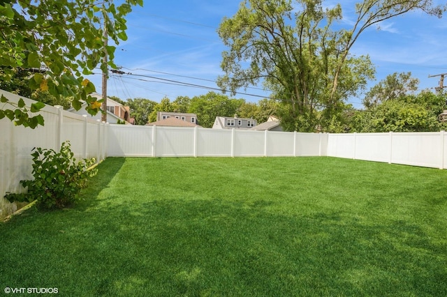 view of yard with a fenced backyard