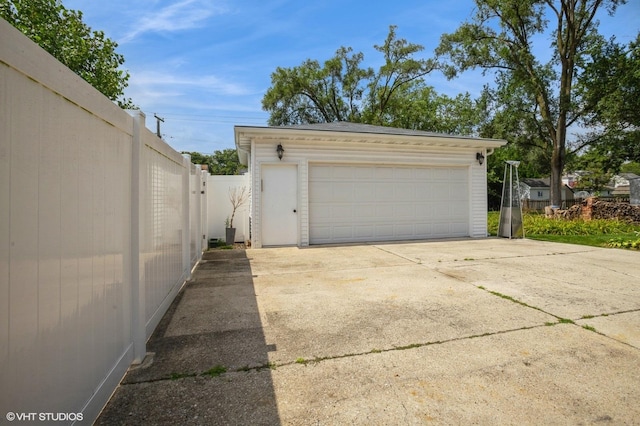 detached garage with fence