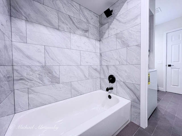 bathroom with tile patterned flooring and  shower combination