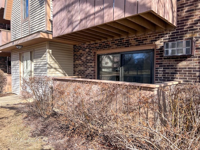 view of side of property with brick siding