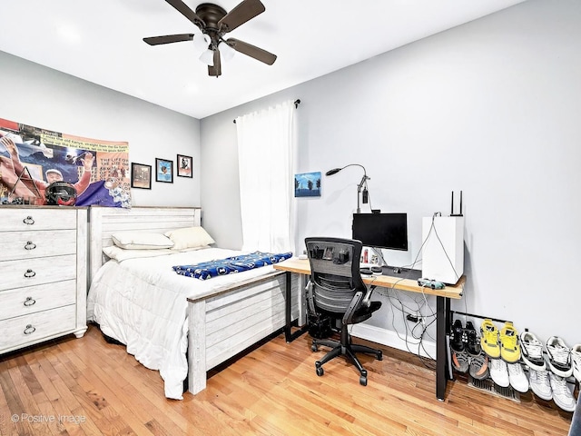 bedroom with wood finished floors and ceiling fan