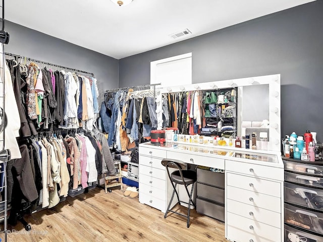 spacious closet featuring light wood-style flooring and visible vents