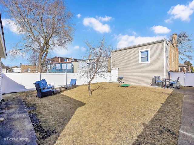 view of yard featuring a patio area and a fenced backyard