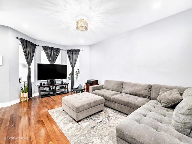 living room with baseboards and hardwood / wood-style flooring