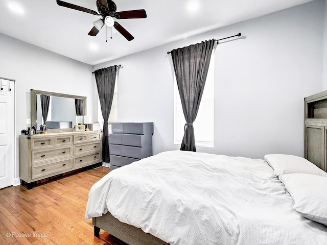 bedroom with recessed lighting, light wood-style floors, and ceiling fan