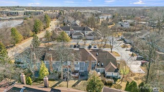 birds eye view of property with a residential view