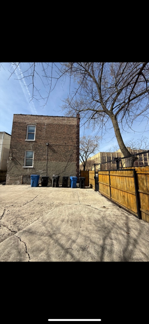 view of side of property with fence