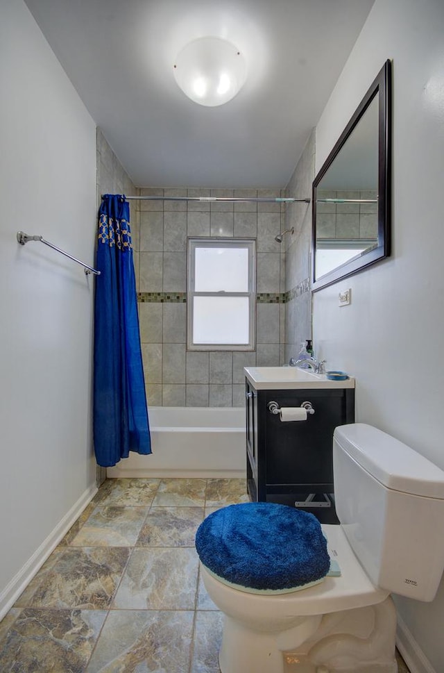 full bathroom featuring vanity, toilet, shower / bathtub combination with curtain, and baseboards