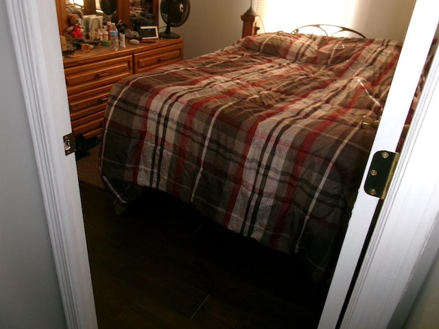 bedroom with wood finished floors