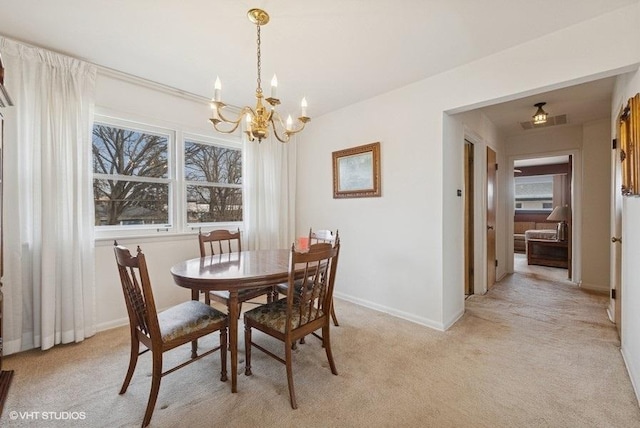 dining area featuring baseboards, visible vents, light carpet, and an inviting chandelier