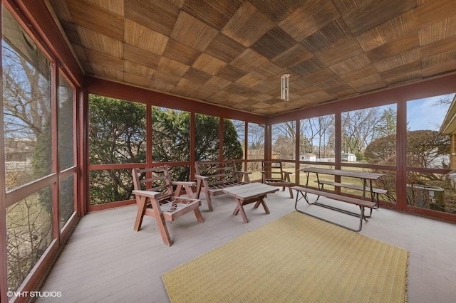 unfurnished sunroom featuring wooden ceiling