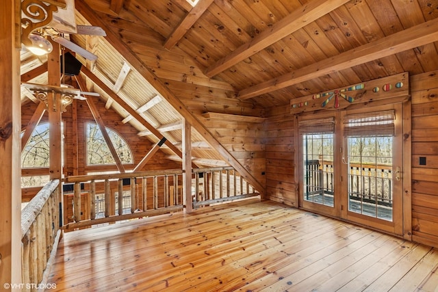 bonus room with wood walls, wooden ceiling, lofted ceiling with beams, and wood-type flooring