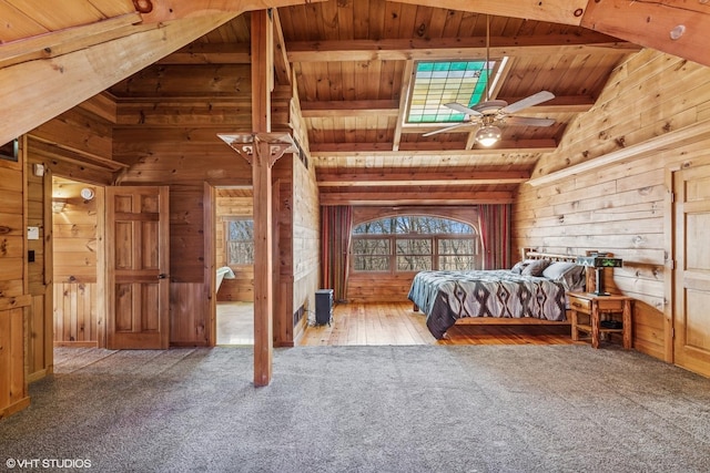 unfurnished bedroom featuring carpet flooring, wood ceiling, and wood walls