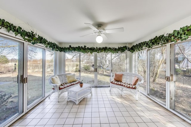 unfurnished sunroom with plenty of natural light and ceiling fan