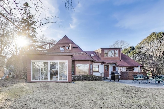 rear view of house featuring a patio