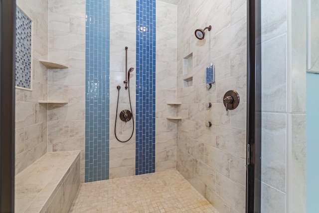 full bath with a tile shower