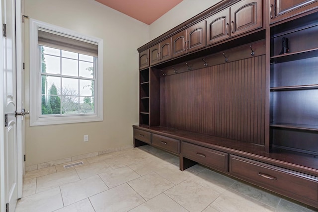 mudroom with light tile patterned floors, baseboards, and visible vents