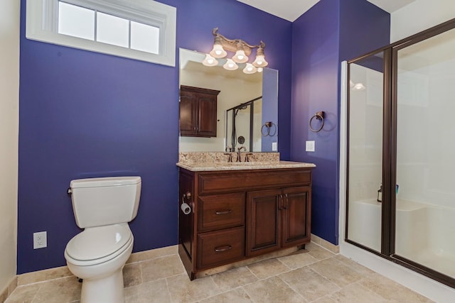 full bathroom featuring vanity, toilet, baseboards, and a stall shower