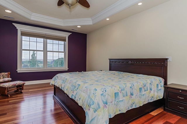 bedroom featuring crown molding, recessed lighting, and dark wood-style flooring