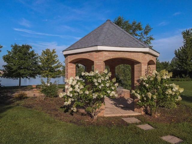 view of property's community with a gazebo and a yard