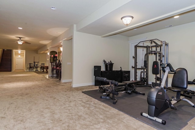 exercise room with recessed lighting, baseboards, and carpet floors