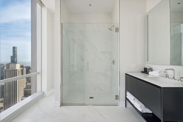 full bath featuring vanity, a view of city, marble finish floor, and a marble finish shower