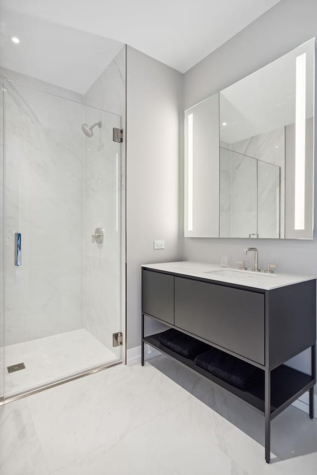 bathroom featuring a stall shower and vanity