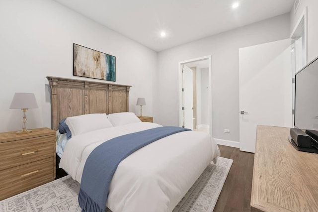 bedroom featuring dark wood-type flooring, recessed lighting, baseboards, and visible vents