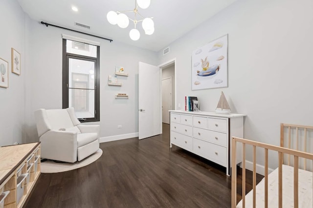 bedroom with visible vents, baseboards, a notable chandelier, and dark wood-style floors